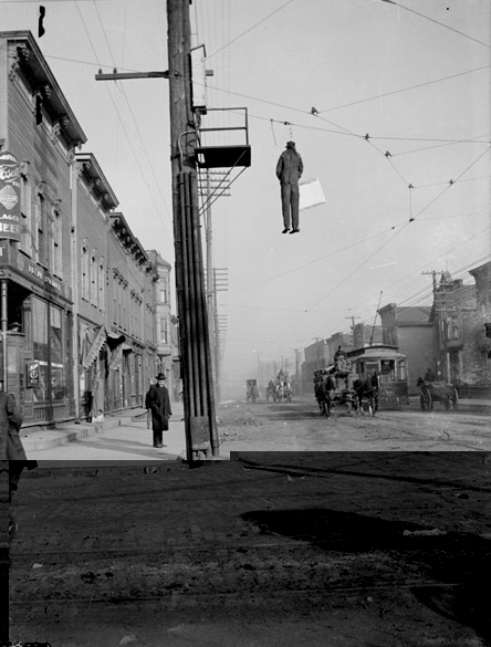 Image of an Effigy Hanging from a Cable Line
