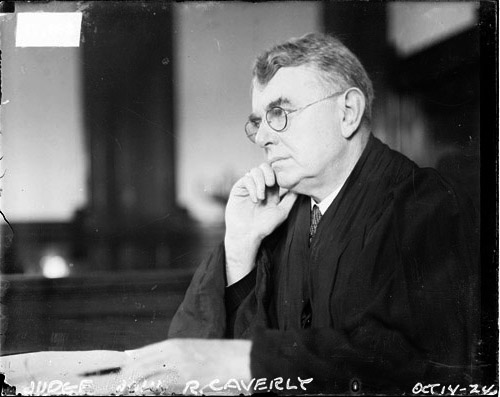 Cook County Circuit Court Judge John R. Caverly sitting behind judge's bench